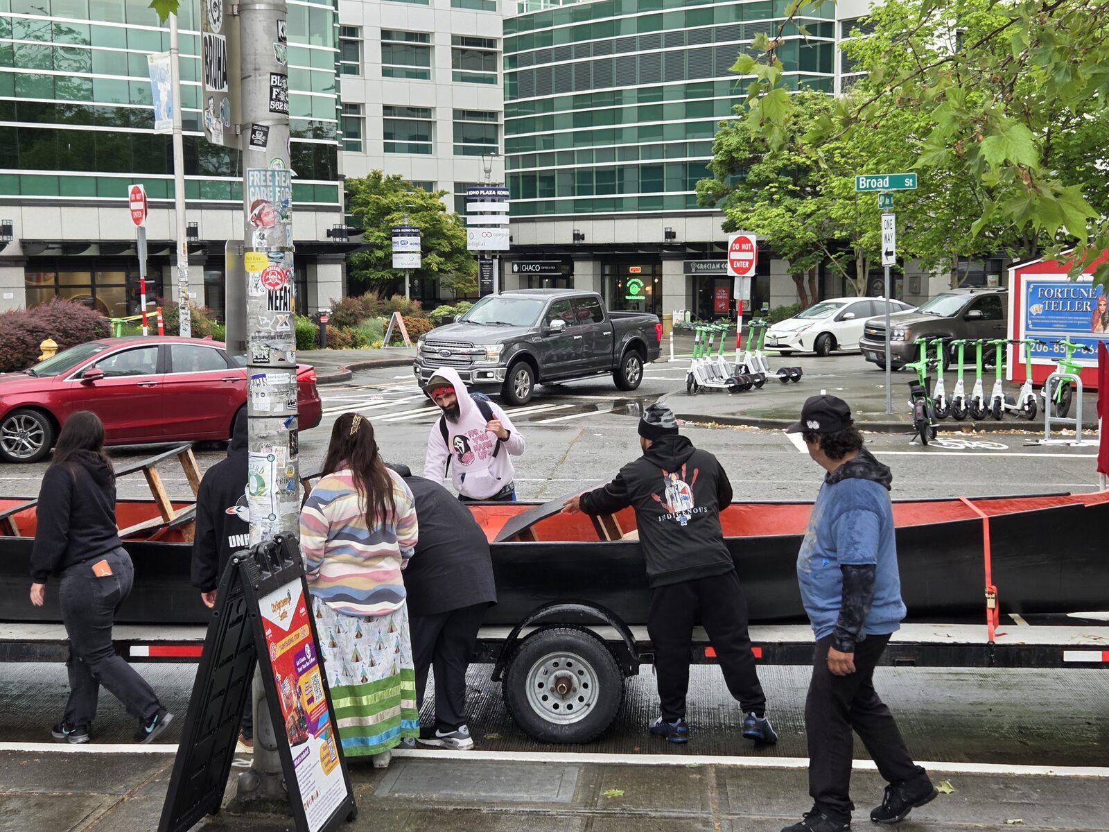 Makah-style whaling canoe on a trailer, downtown Seattle, departing NW Folklife 2026